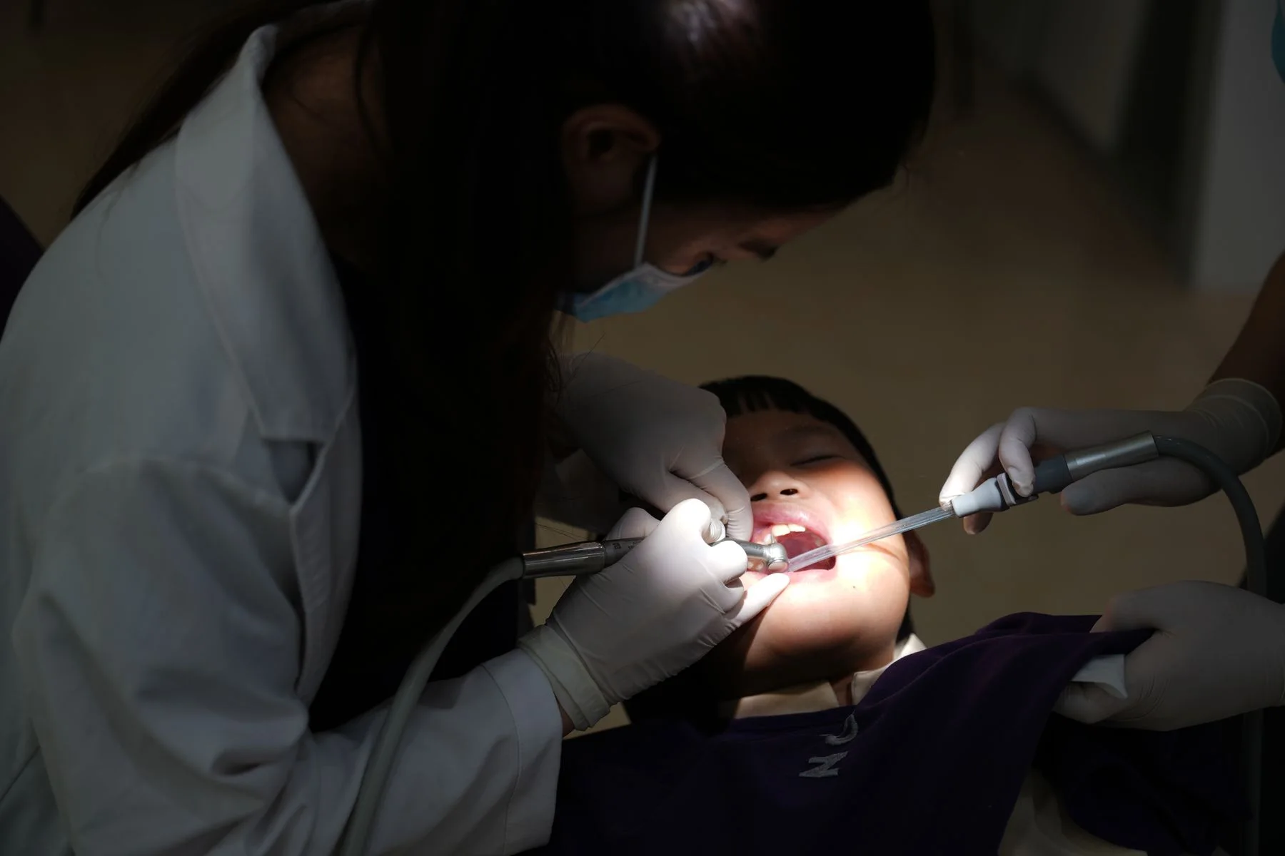 Child smiling during a family-centered dental visit