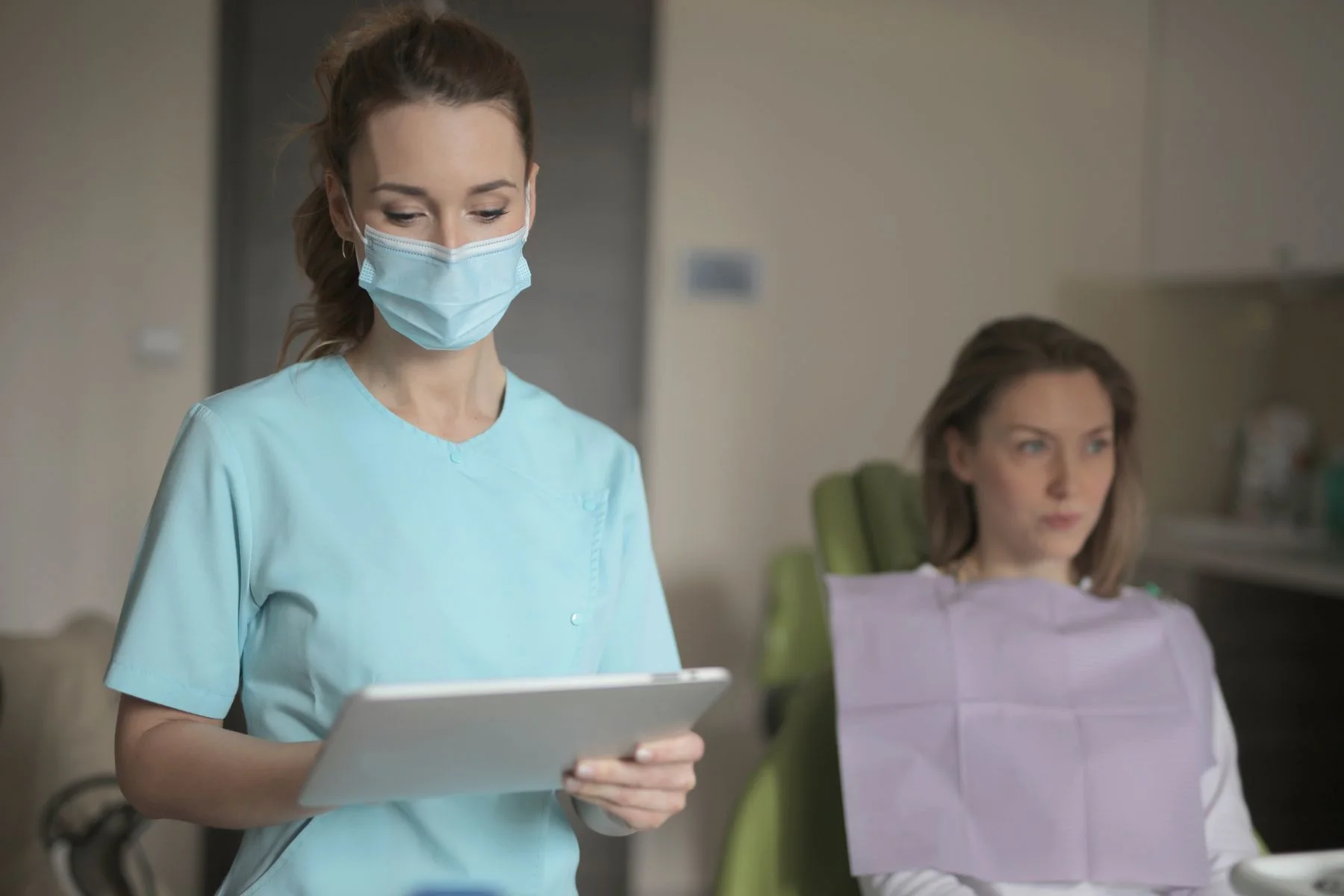Dental team member using a connected tablet workflow