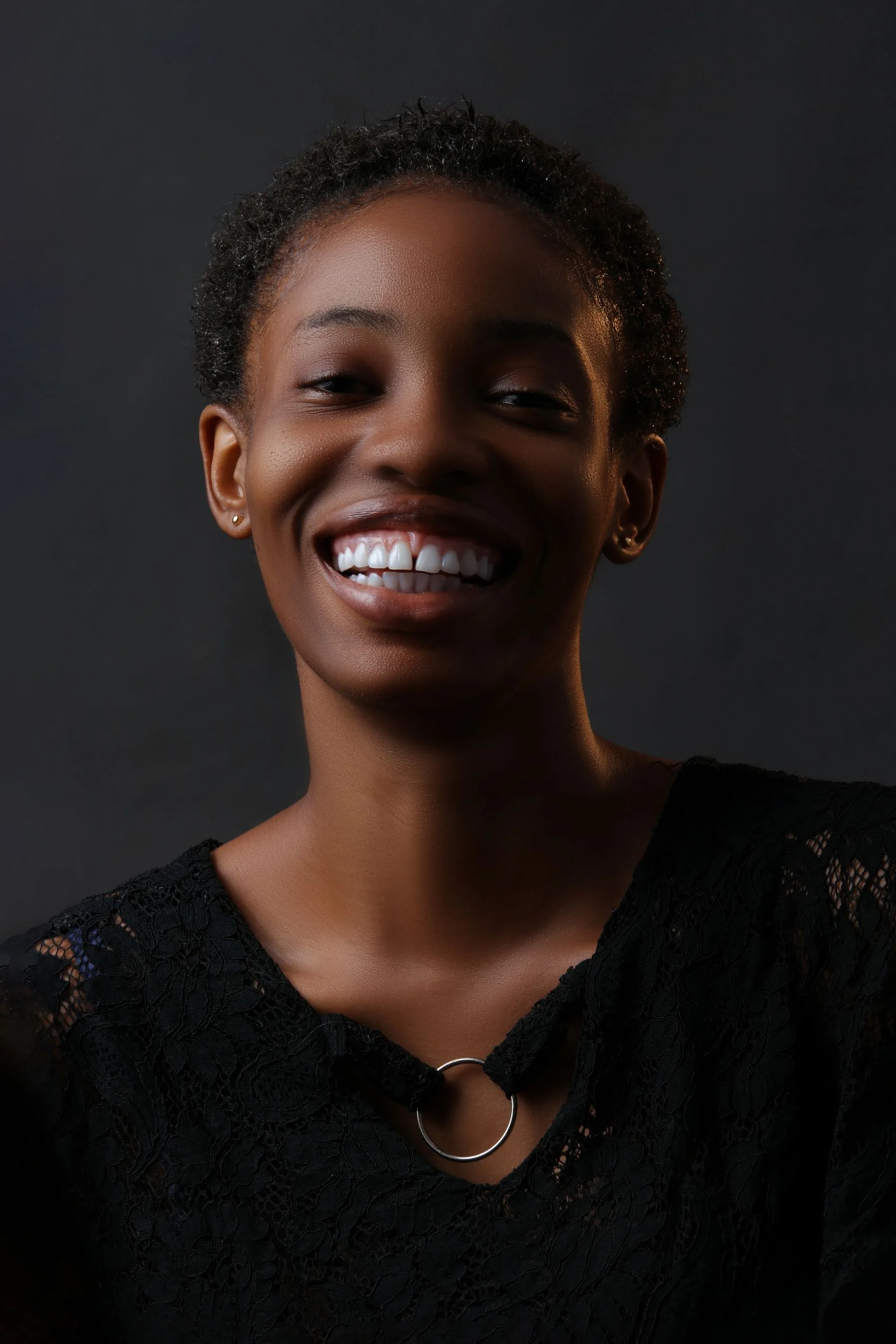Smiling woman considering clear aligner treatment